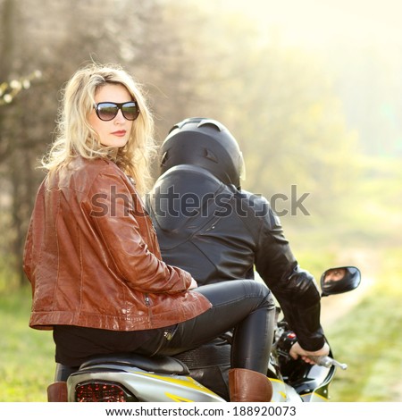 stock-photo-biker-girl-with-sunglasses-sitting-on-motorcycle-450w-188920073.jpg
