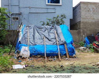 Stock Photo Of Blue Color Plastic Handmade Temporary Housing Structure Or Shelter Or Tent For Homeless People Or Construction Worker Near Construction Site At Hyderabad, Telangana, India.