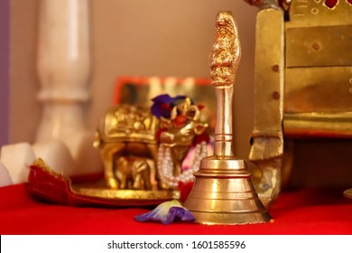 Stock Photo Of A Brass Pooja Room Bell With Temple Deity In Background. It Drowns Inauspicious Noises And Brings Spiritual Vibrations To The Prayer Ceremony.It Produces Strains Of Om. Selective Focus.