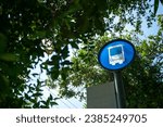 A stock photo of a bus stop typically features an image of a bus stop or bus shelter, which is a designated place where people can wait for a public bus to arrive.