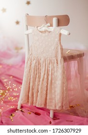Stock Photo - Child dress on hanger on pink background - Shutterstock ID 1726307929