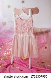Stock Photo - Child dress on hanger on pink background - Shutterstock ID 1726307950
