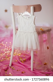 Stock Photo - Child dress on hanger on pink background - Shutterstock ID 1727360896