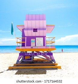 Stock photo of a lifeguard station in Miami Beach. Photo with a life guard looking to the sea. Photo taken in a summer sunny day.