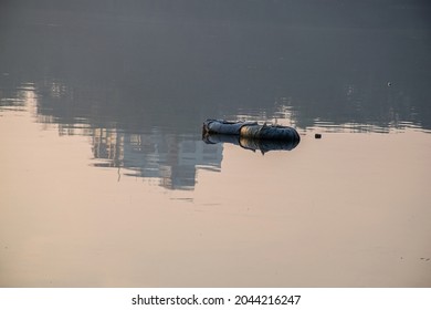 Stock Photo Of Two Black Inner Tube Cover By Black Color Plastic Floating On Lake Water At Rankala Lake , Kolhapur, Maharashtra, India. Picture Capture At Early Morning. Selective Focus.