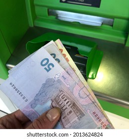 Stock photo Ukrainian money from bank terminal. Ukrainian hryvnia money cash