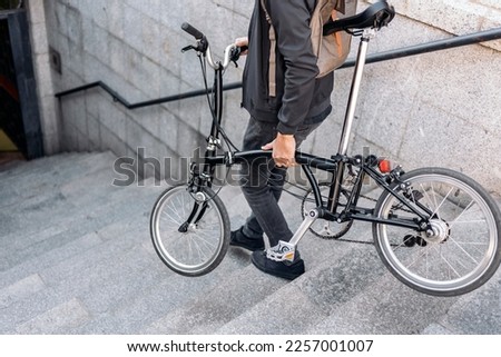Stock photo of unrecognized man going down the stairs with his bike. Foto stock © 