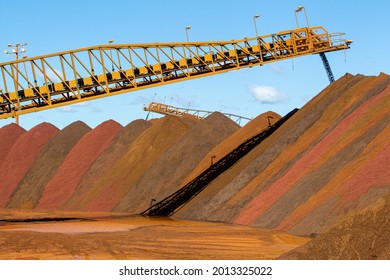 stock piles of iron ore at port. - Shutterstock ID 2013325022