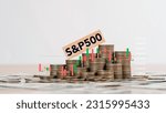 stock S and P 500 Index fund symbol is on wooden cubes in stack coins symbolizing that the S and P 500 Index is changing the trend, goes up instead of down. Business, S and P 500 concept.