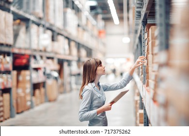 stock taking. beautiful young woman worker of furniture store. - Powered by Shutterstock