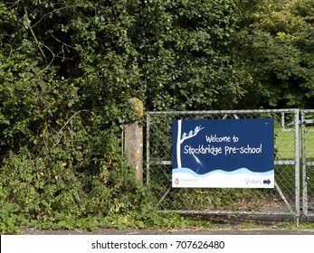 Stockbridge, Hampshire England - June 19, 2017: Welcome To Stockbridge Pre School Banner Mounted On Gate To Playing Field