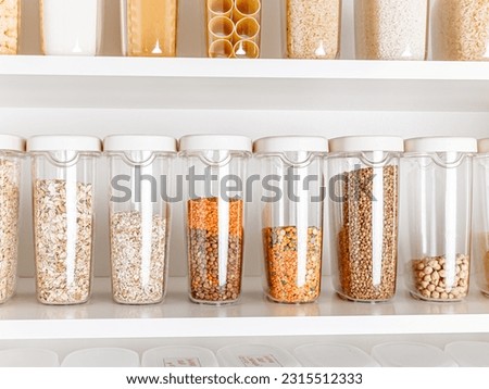 Stocked kitchen pantry with food. The organization and storage in a kitchen in plastic containers. White modern kitchen. full kitchen pantry food storage illustration