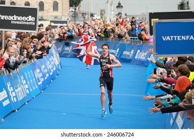 STOCKHOLM - AUG 23, 2014: Jonathan Brownlee waiving Union Jack in the finish of the race Men's ITU World Triathlon series event August 23, 2014 in Stockholm, Sweden