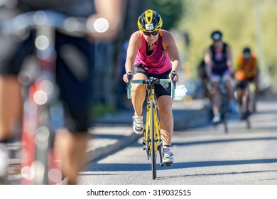 STOCKHOLM - AUG 23, 2015: Focused Triathlete Cyclist In Front View At The ITU World Triathlon Event In Stockholm.