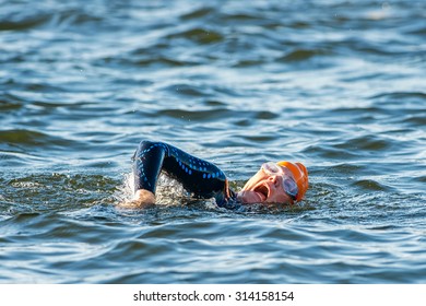 STOCKHOLM - AUG 23, 2015: Triathlete Gasping For Air At The Womens ITU World Triathlon Event In Stockholm.