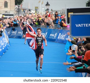 STOCKHOLM - AUG 23: Jonathan Brownlee in the finish of the race only a few yards before his brother in the Men's ITU World Triathlon series event August 23, 2014 in Stockholm, Sweden