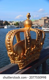 Stockholm landmarks. Golden crown sculpture on Skeppsholmsbron bridge in Stockholm city, Sweden.
