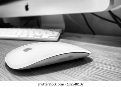 STOCKHOLM - MARCH 18: Mac (magic) Mouse, Monitor And Keyboard On Table In Room In Black And White. March 18, 2014 In Stockholm, Sweden.