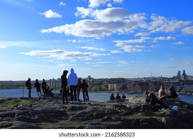 Stockholm, Sweden. 05-08-2022. Relaxing Crowd Of People At The Top Of A Hill Called Skinnarviksberget. Great View Over The City And Swedish Capital. One Day In May.