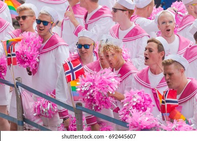 STOCKHOLM SWEDEN, 5 AUG, 2017: Norweigian choir called the Faggots at the pride parade in Stockholm with happy people and waving flags. Aprox 45 000 participants in the parade.