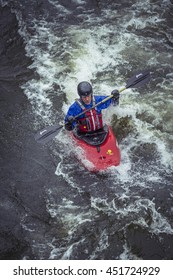 Stockholm, Sweden - April 04, 2016:Man Kayaking In Fast Flowing Rapids. Kayaking In Stockholm. Canoeing On Water River.