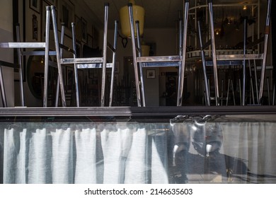 Stockholm, Sweden April 15, 2022 A Closed Restaurant And Restaurant Window With Stools.