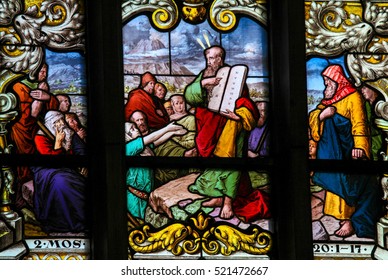 STOCKHOLM, SWEDEN - APRIL 16, 2010: Stained glass window depicting Moses showing the Stone Tablets with the Ten Commandments, in Saint James's Church in Stockholm, Sweden.