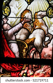 STOCKHOLM, SWEDEN - APRIL 16, 2010: Elijah on the Chariot of Fire ascending to Heaven, according to bible verse 2 Kings 2:11, stained glass in the German Church in Stockholm.