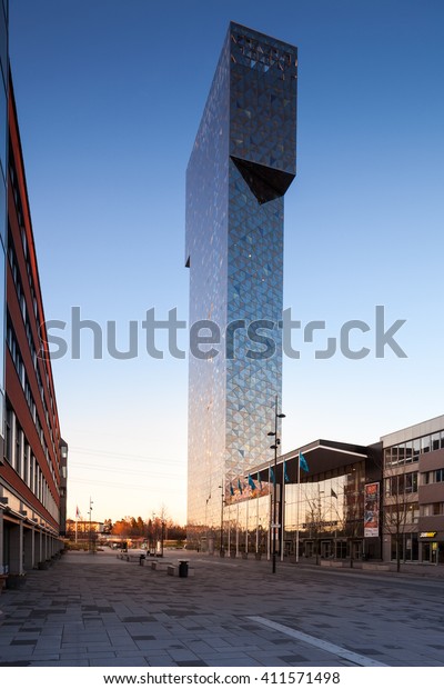 Stockholm, Sweden - April 24, 2016 : Sunset\
reflected on the Victoria Tower located in Kista IT Area, called\
the Silicon Valley of\
Sweden.