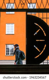 Stockholm, Sweden April 25, 2021 A Male Pedestrian Walks By An Open Iron Gate In A  Public Stairway Between Atlasgatan And Sankt Eriksgatan