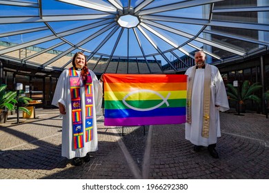 Stockholm, Sweden April 25, 2021 Two Priests In The Swedish Church Pose With A Rainbow LGTBQ Flag To Promote Diversity Within The Church.