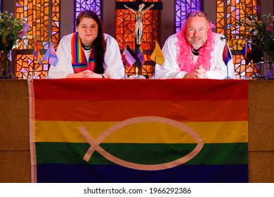 Stockholm, Sweden April 25, 2021 Two Priests In The Swedish Church Pose With A Rainbow LGTBQ Flag To Promote Diversity Within The Church.