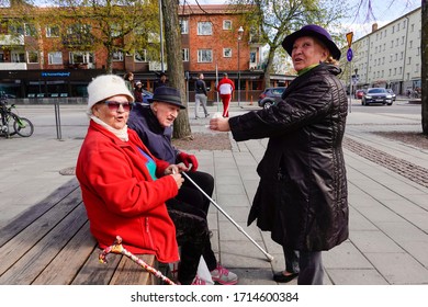 Stockholm, Sweden April 26, 2020 Three Seniors Enyoing Ice Cream On A Sunday Afternoon On The Square In The Arsta Suburb.