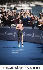 STOCKHOLM, SWEDEN - AUG 26, 2017: Winner Flora Duffy (BER) Running Into The Finish Area With The Crowd Cheering At The Womens ITU Triathlon Series. Female Olympic Distance.