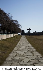 Stockholm / Sweden - February 24 2018: Road Leading Up To The Massive Granite Cross, At The UNESCO World Heritage The Woodland Cemetery - Skogskyrkogården.