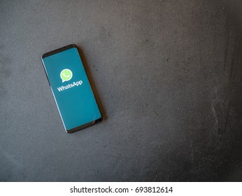 STOCKHOLM, SWEDEN - JULY 10, 2017:  WhatsApp Application On Screen Of A Smartphone. Dark Background.