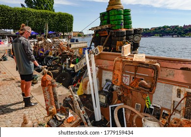 Stockholm, Sweden July 18, 2020 Trash pulled up from the bottom of Lake Malaren and displayed on a barge, a community project called Rena Malaren.