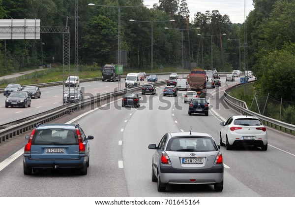 STOCKHOLM, SWEDEN - JULY 4 2017: Car traffic on the\
highway through Stockholm\
\
