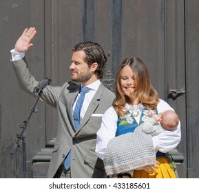 STOCKHOLM, SWEDEN - JUN 06, 2016: The Swedish Prince Carl Philip Bernadotte Smiling And Waiving To The Audience And Princess Sofia Hellqvist Holding The Newborn Baby Alexander