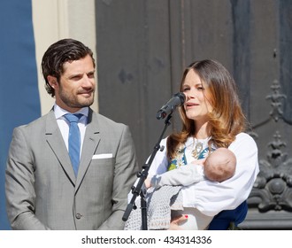 STOCKHOLM, SWEDEN - JUN 06, 2016: The Swedish Prince Carl Philip Bernadotte And Princess Sofia Hellqvist Holding The Newborn Baby Alexander In Front Of The Royal Castle During The Swedish National Day