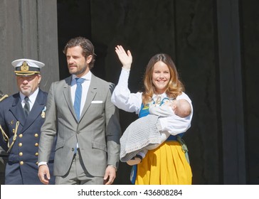 STOCKHOLM, SWEDEN - JUN 06, 2016: The Swedish Prince Carl Philip Bernadotte And Princess Sofia Hellqvist Waiving And Holding The Newborn Baby Alexander