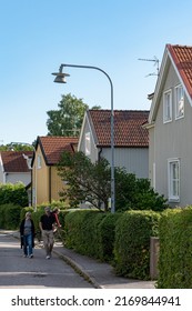 Stockholm, Sweden June 20, 2022 Single Family Residential Houses In The Bromma District.and A Couple Walking.