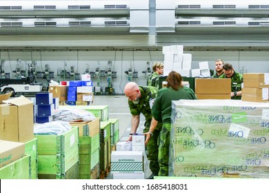 Stockholm, Sweden March 27, 2020 The Stockholm Fair Grounds Are Being Turned Into A Temporary External Hospital To Handle Covid 19 Cases. Here A Warehouse Full Of Medical Supplies Getting Unpacked By 