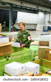 Stockholm, Sweden March 27, 2020 The Stockholm Fair Grounds Are Being Turned Into A Temporary External Hospital To Handle Covid 19 Cases. Here A Warehouse Full Of Medical Supplies Getting Unpacked By 