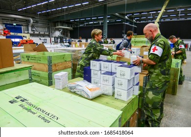 Stockholm, Sweden March 27, 2020 The Stockholm Fair Grounds Are Being Turned Into A Temporary External Hospital To Handle Covid 19 Cases. Here A Warehouse Full Of Medical Supplies Getting Unpacked By 