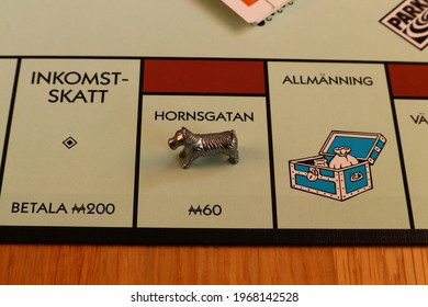 Stockholm, Sweden. May 02, 2021. Monopoly Board Game. Close Up Over The Brown Street Called Hornsgatan. Written In Swedish. The Metal Dog Token. Classical Boardgame.