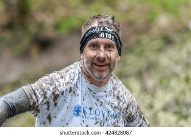 STOCKHOLM, SWEDEN - MAY 14, 2016 Dirty Face At The Muddy Net Trap In Tough Viking Obstacle Course Around Stockholm Stadion.