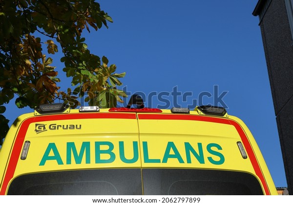 Stockholm, Sweden. October 17, 2021. Back door of\
the emergency ambulance car. Swedish text and spelling. Sunny light\
shining this day.