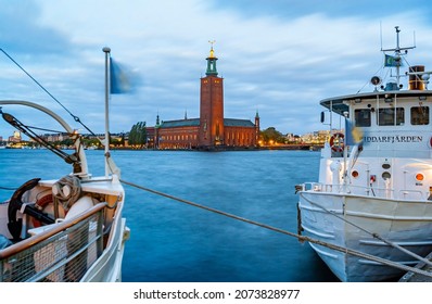 Stockholm, Sweden - Okt 22, 2005: Local ferry transportation in Stockholm in foreground and the city hall