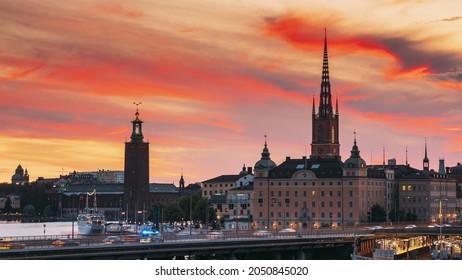 Stockholm, Sweden. Scenic View Of Stockholm Skyline At Summer Evening. Famous Popular Destination Scenic Place In Sunset Lights. Riddarholm Church, Subway Railway. Day To Night Transition Time Lapse.